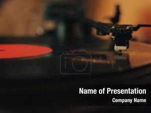 Vinyl Player Stylus on a Rotating Disc PowerPoint Template