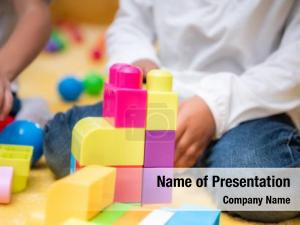 Kid Playing In Kindergarten