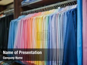 Row of Colorful Shirts in Store PowerPoint Template