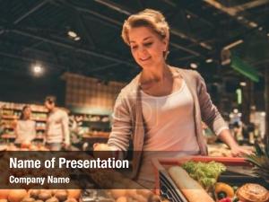 Woman Doing Grocery Shopping at Supermarket PowerPoint Template