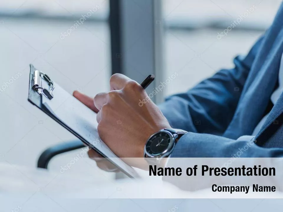 Businessman Writing on Clipboard