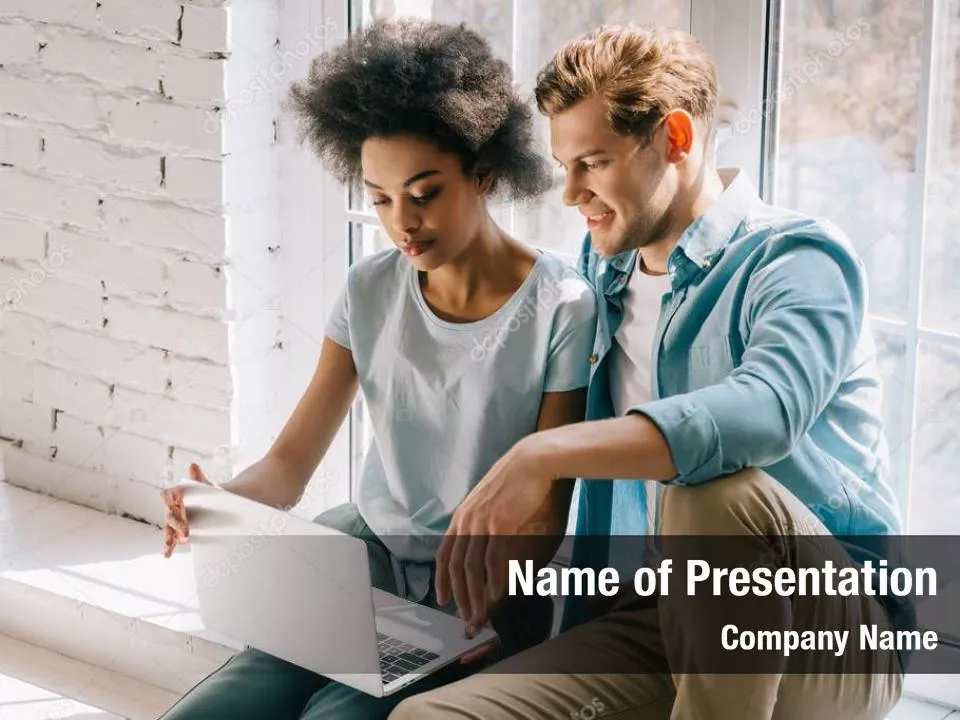 Couple Looking at Laptop Computer