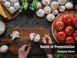 Woman cropped shot cutting mushrooms PowerPoint Template