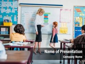 Adorable teacher talking little schoolgirl PowerPoint Template