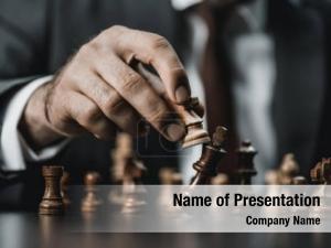 Businessman close view holding chess PowerPoint Template