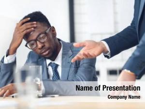 American exhausted african businessman listening