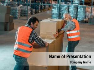 Vests warehouse workers moving boxes