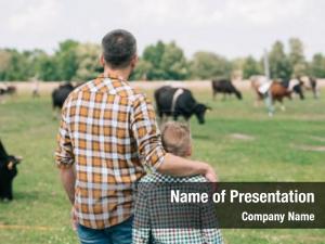 Father back view son standing PowerPoint Template