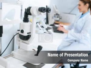 Optometrist selective focus working computer PowerPoint Template