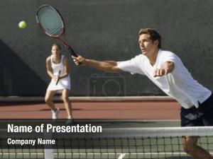 Tennis mixed doubles player reaching