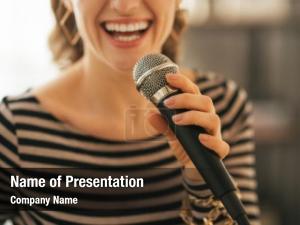 Woman closeup young singing microphone