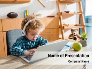 Typing curly kid laptop near PowerPoint Template