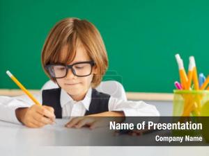 Schoolboy clever boy writes pencil PowerPoint Template