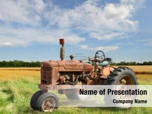 Old tractor on the grass field