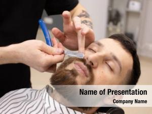 Client during beard and moustache grooming in barber shop