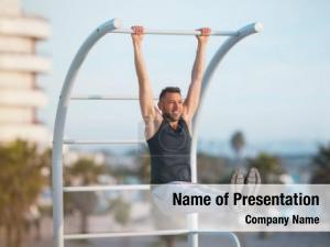 Fitness, sport, training and lifestyle concept - young man exercising on horizontal bar outdoors