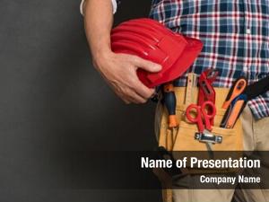  Bricklayer holding red helmet and kit tool