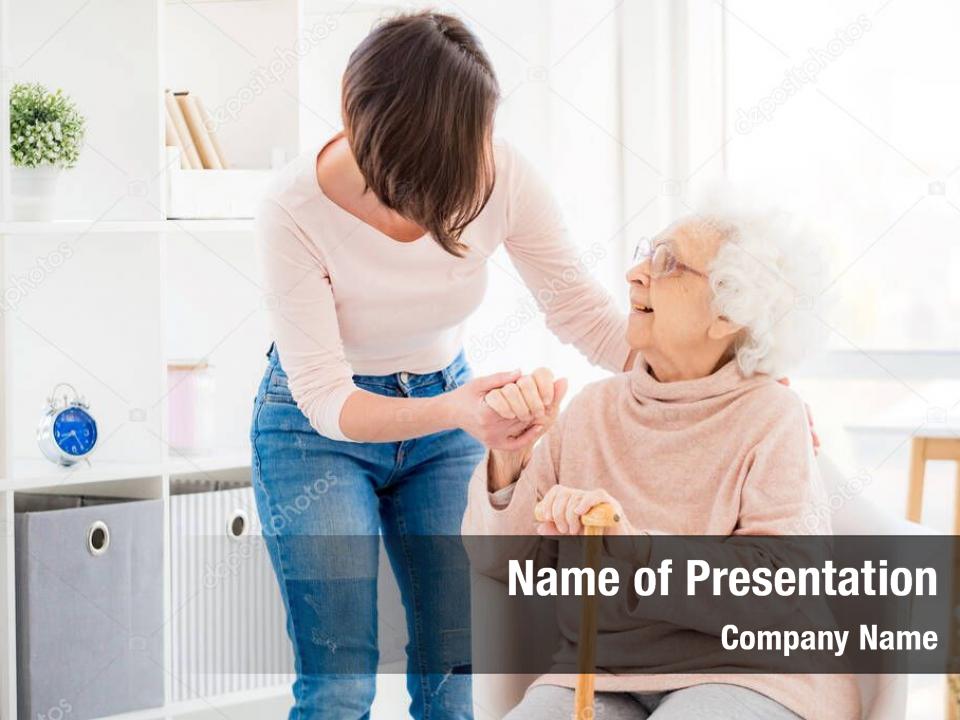 Kind woman helping lovely old lady to stand from chair