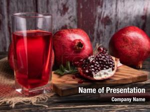 Pomegranate juice with pomegranate on a wooden board on a dark 