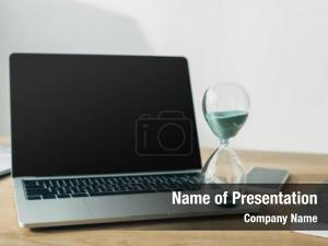 Blank hourglass laptop screen near PowerPoint Template