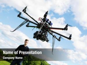 Flying young technician uav drone PowerPoint Template