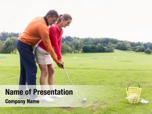 Instructor male golf teaching female