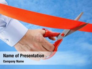 Red businessman cutting ribbon pair