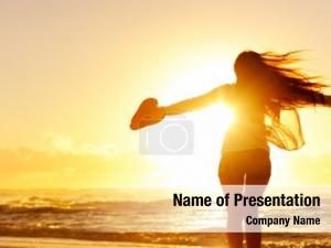 Dancing carefree woman sunset beach