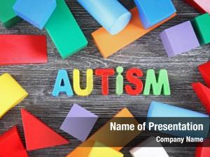 Colorful word autism figures wooden