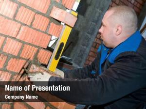 Worker construction mason bricklayer checking