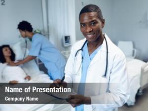 Male portrait african american doctor writing