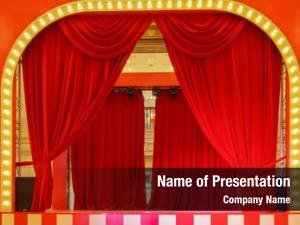 Red theater stage curtains spotlights