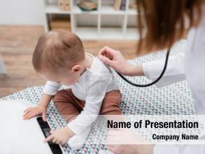 Examining family doctor baby boy PowerPoint Template