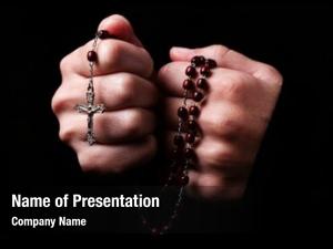 Praying female hands holding rosary
