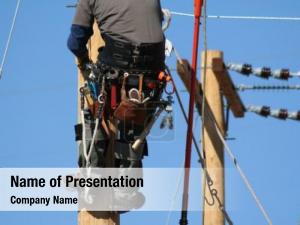 Apprentice electrical lineman working pole