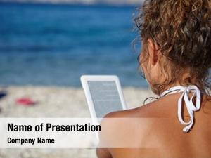 Vacation woman e reader beach reading