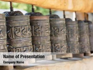 Cylindrical prayer wheel wheel spindle PowerPoint Template