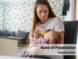 Baby mother holds baby bottle