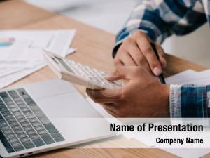 Man Working with Laptop and Calculator PowerPoint Template