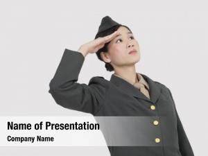Military serious female officer saluting