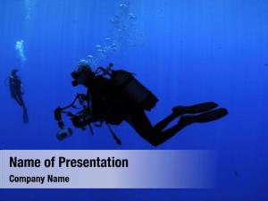 Photographer silhouette underwater  