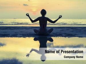 Woman silhouette yoga meditating ocean