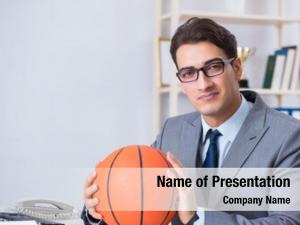 Playing young businessman basketball