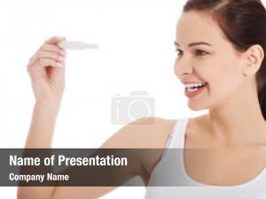 Holding smiling woman pregnancy test,