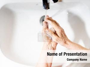 Washing elderly woman hands soap