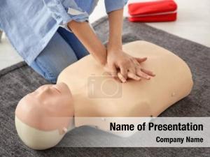 First woman practicing aid mannequin,