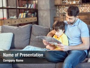 Son focused father reading newspaper