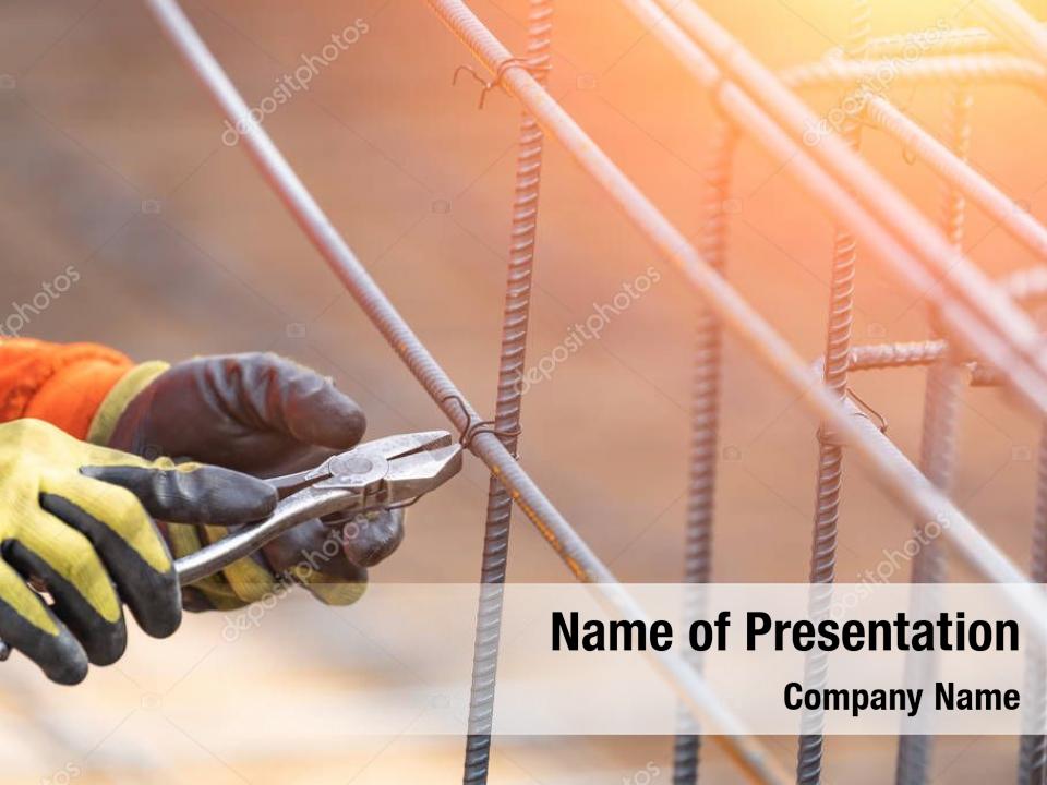 Steel worker securing rebar framing