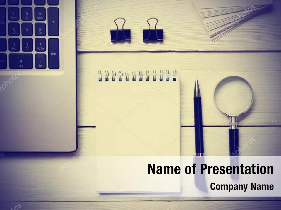 Notebook with Magnifying Glass on Wooden Workplace