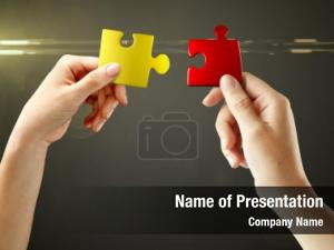 Woman Joining Two Jigsaw Puzzle Pieces